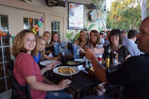Family group dining together on the outdoor patio