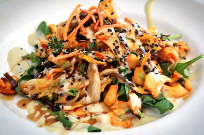 Colorful seafood appetizer with sesame and fresh greens